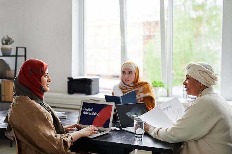 Muslim businesswomen in a meeting with laptops